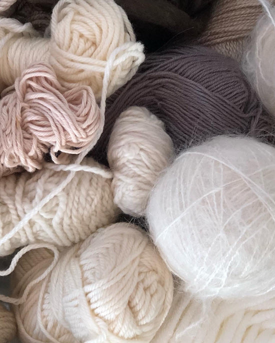 a selection of different types of yarn and wool