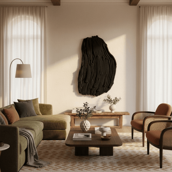 Modern living room with a textured black wall art piece by Knotted by hand, green sofa, and wooden coffee table.