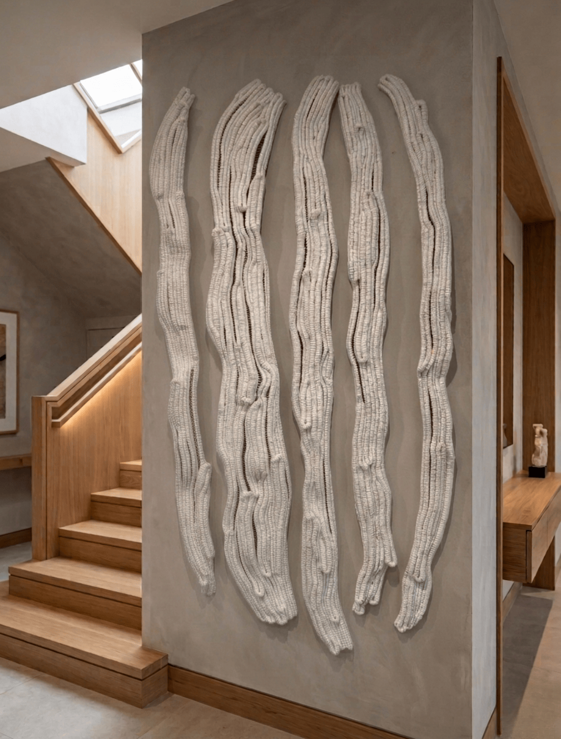 Minimalist fibre art installation adding depth and texture to modern interiors