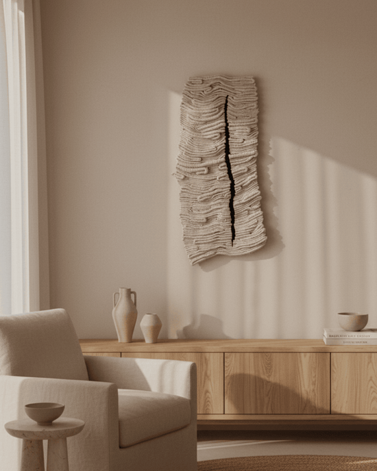 Neutral hand-knotted textile wall art above timber console in modern interior