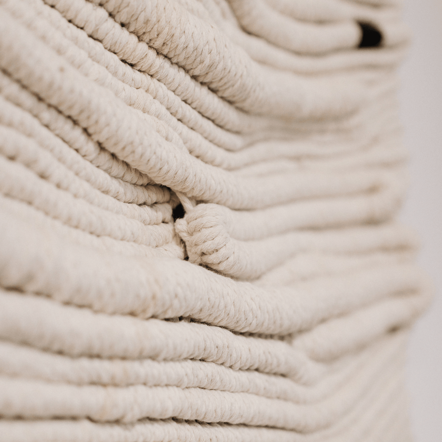 Close-up of beige textured fibre art work