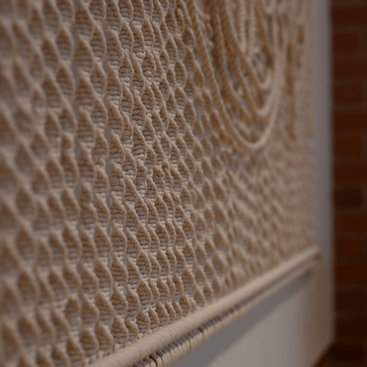 close up of Flow – hand-knotted textile wall art with organic texture