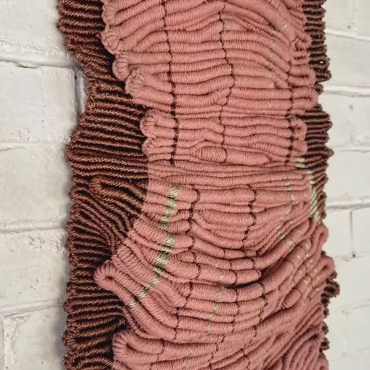 Sculptural fibre artwork with layered cotton rope and gold accents